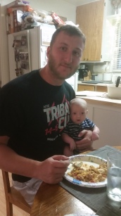 daddy teaching him how to eat